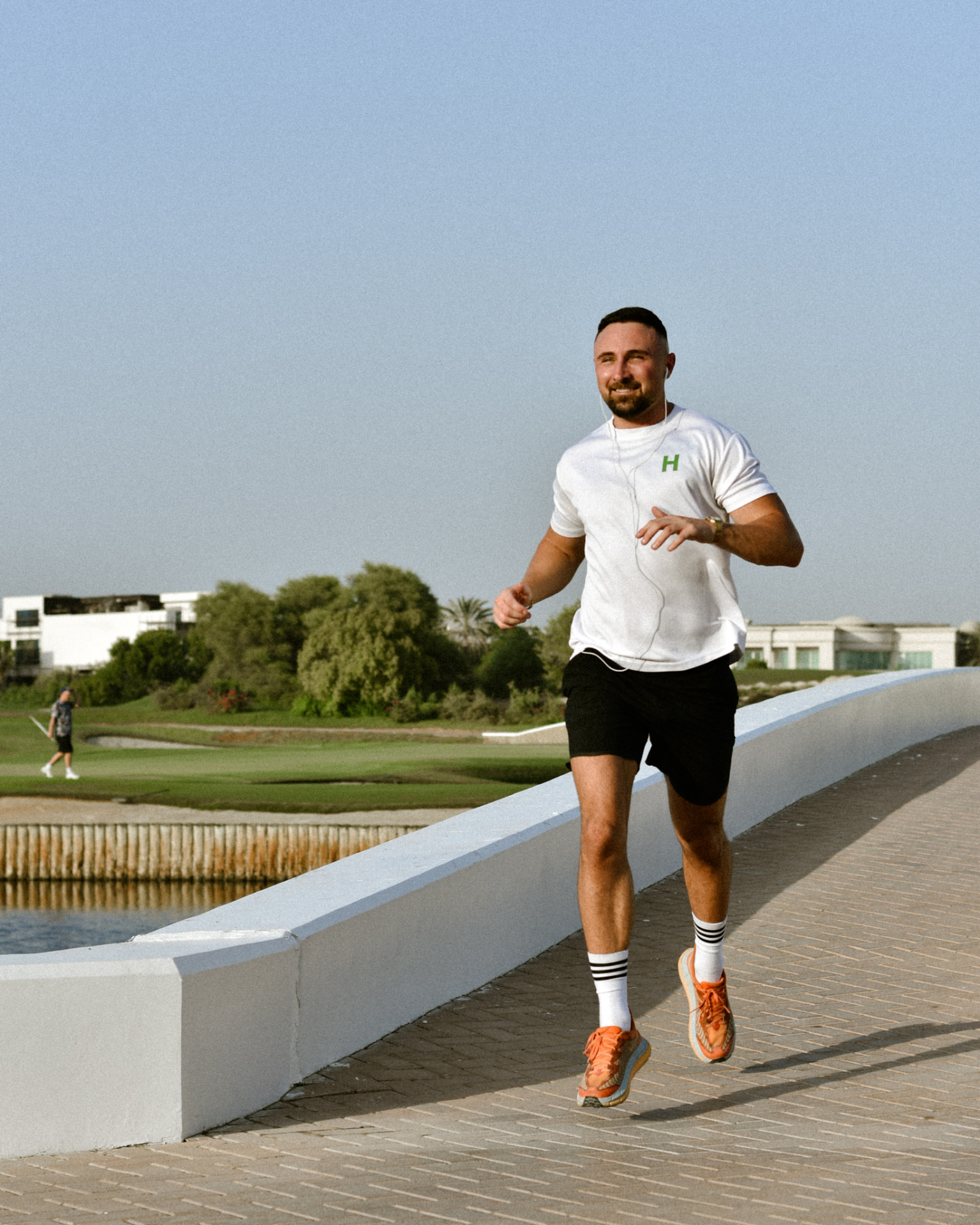 HUNDO runner crossing a bridge in Dubai
